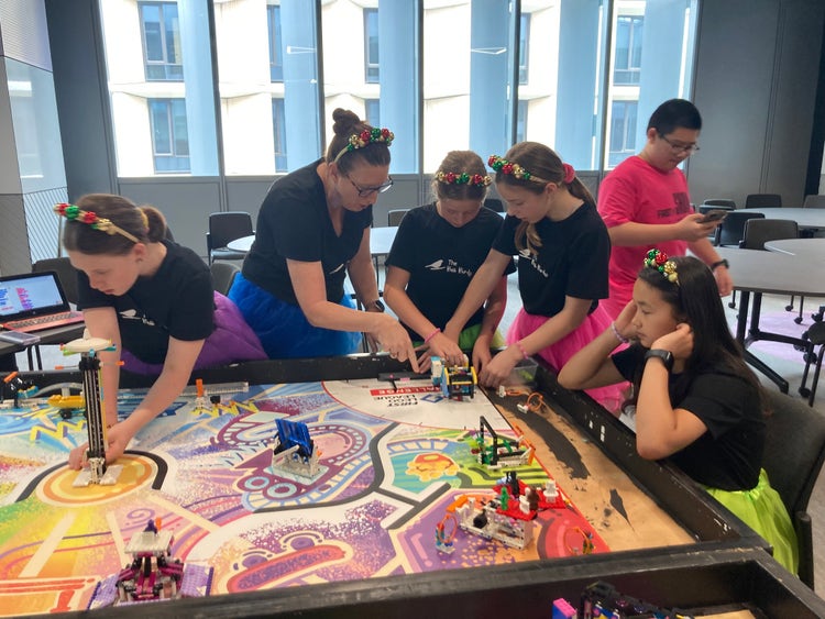 student and teacher around a table
