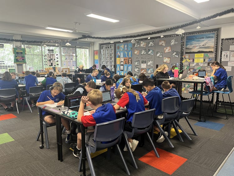 students at desk in classroom