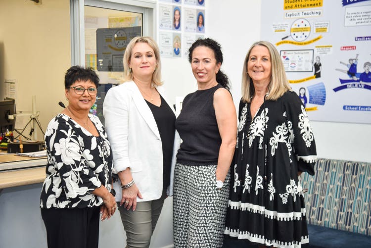 four office ladies standing in a line