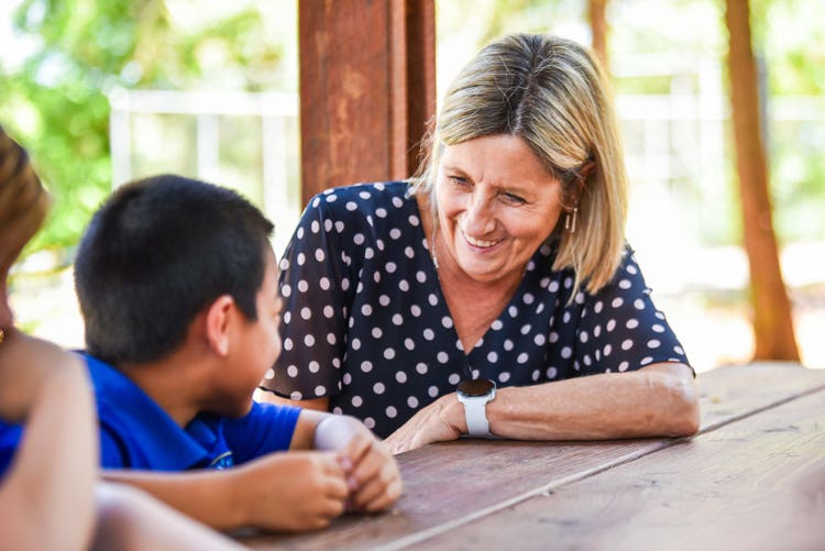 principal smiling with a student